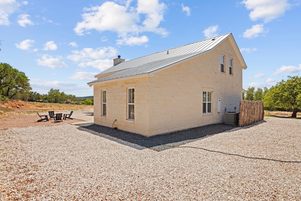 792 Langes Mill Road Doss, TX 78618 - Photo 68 of 76 a view of a house with a patio