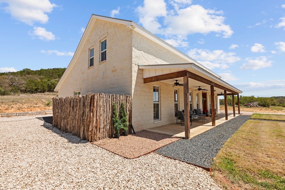 792 Langes Mill Road Doss, TX 78618 - Photo 10 of 76 a view of a house with a yard