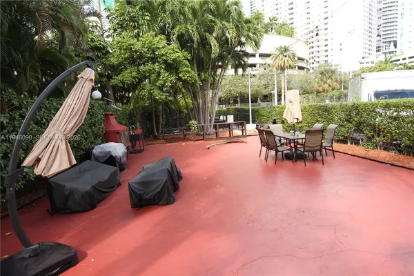 a view of a patio with swimming pool