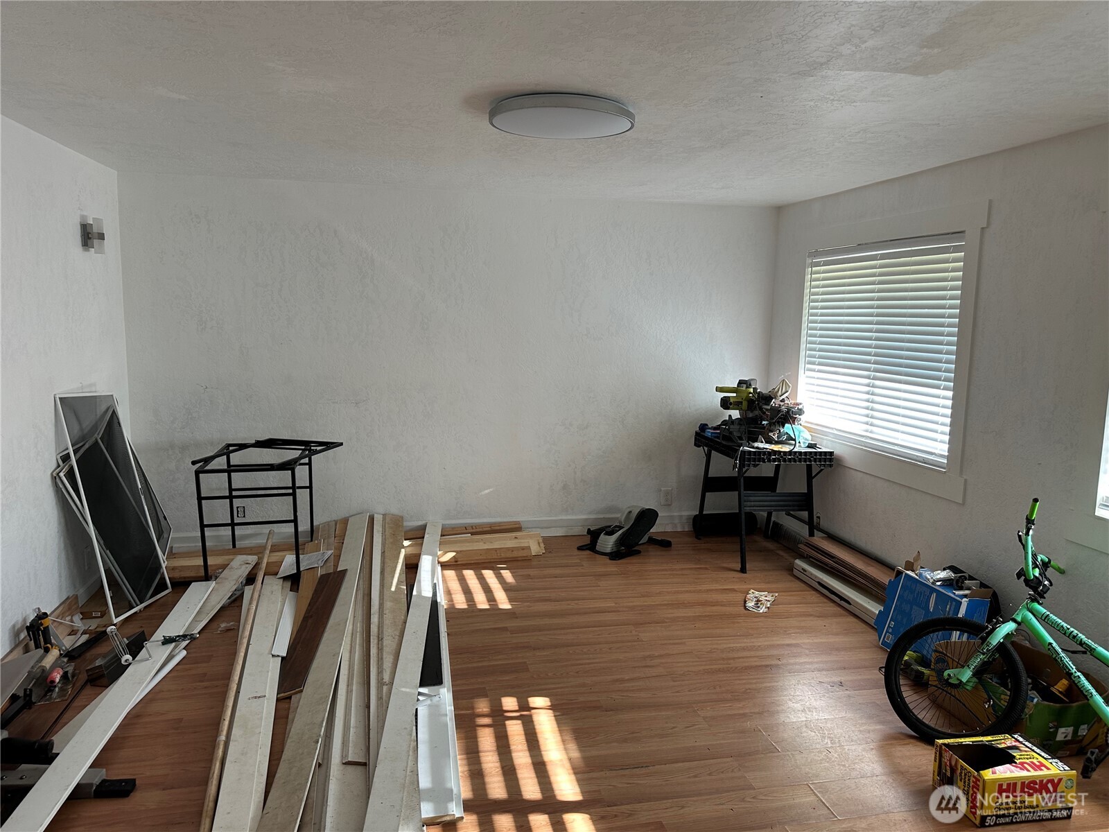 206 West Cushing Street Aberdeen, WA 98520 - Photo 5 of 25 a view of a room with gym equipment on wooden floor