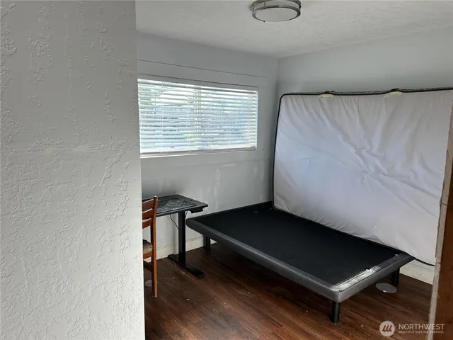 a bench sitting in a room next to a window