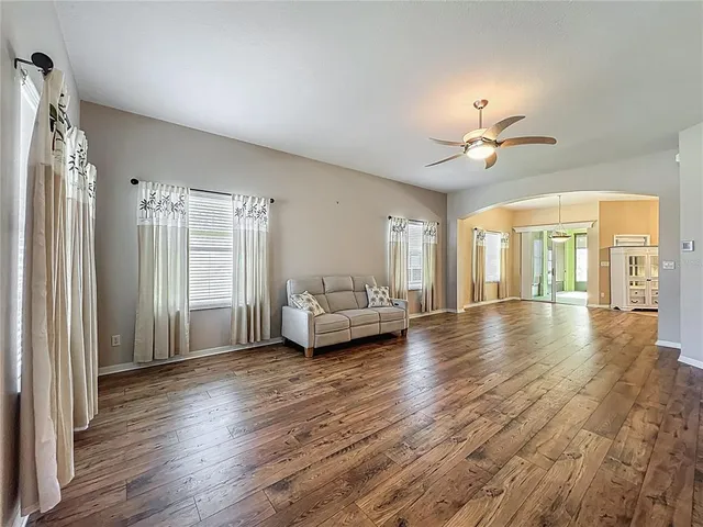 a view of livingroom with furniture wooden floor and chandelier