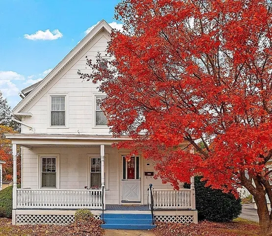 a view of a house with a tree