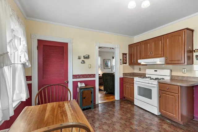 a kitchen with stainless steel appliances granite countertop a stove a sink dishwasher and a refrigerator