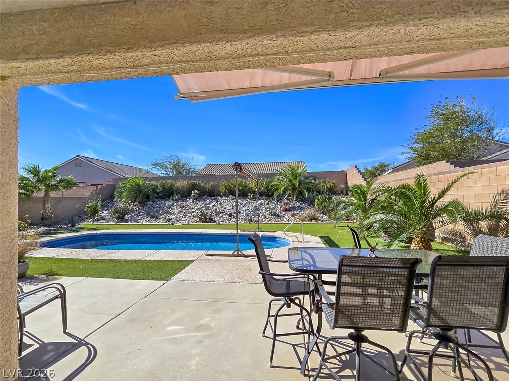 2485 Morrow Ridge Place Laughlin, NV 89029 - Photo 29 of 40 A spacious patio overlooking a private pool, perfect for outdoor leisure.