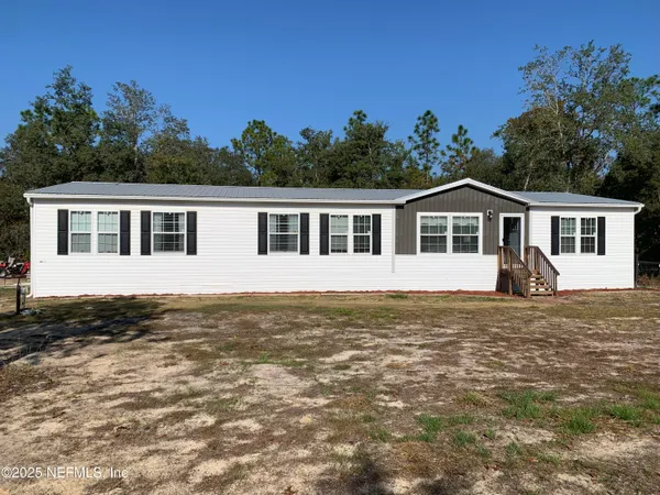 a view of a house with a big yard