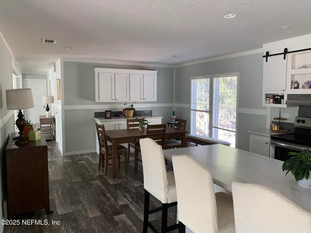 a view of a dining room with furniture