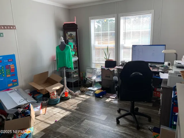 a living room with furniture and a window