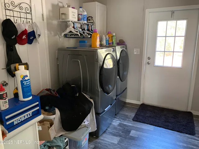 a view of entryway with wooden floor