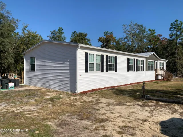 a house with trees in the background