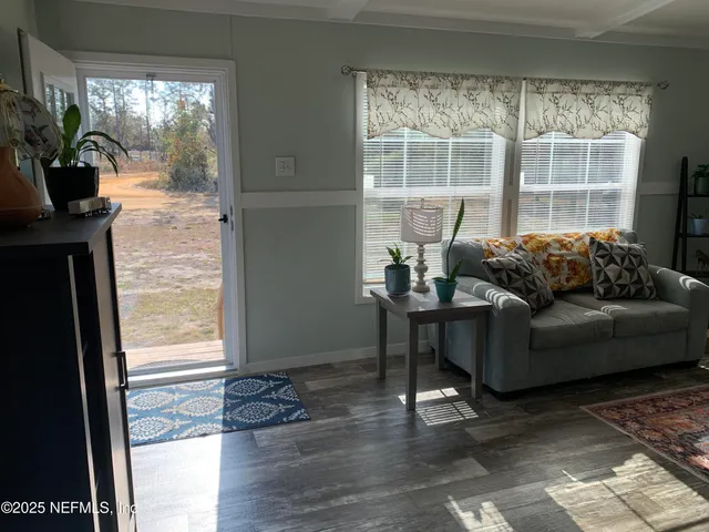 a living room with furniture and a window