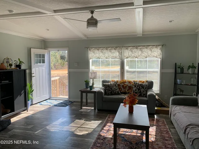 a living room with furniture and a window