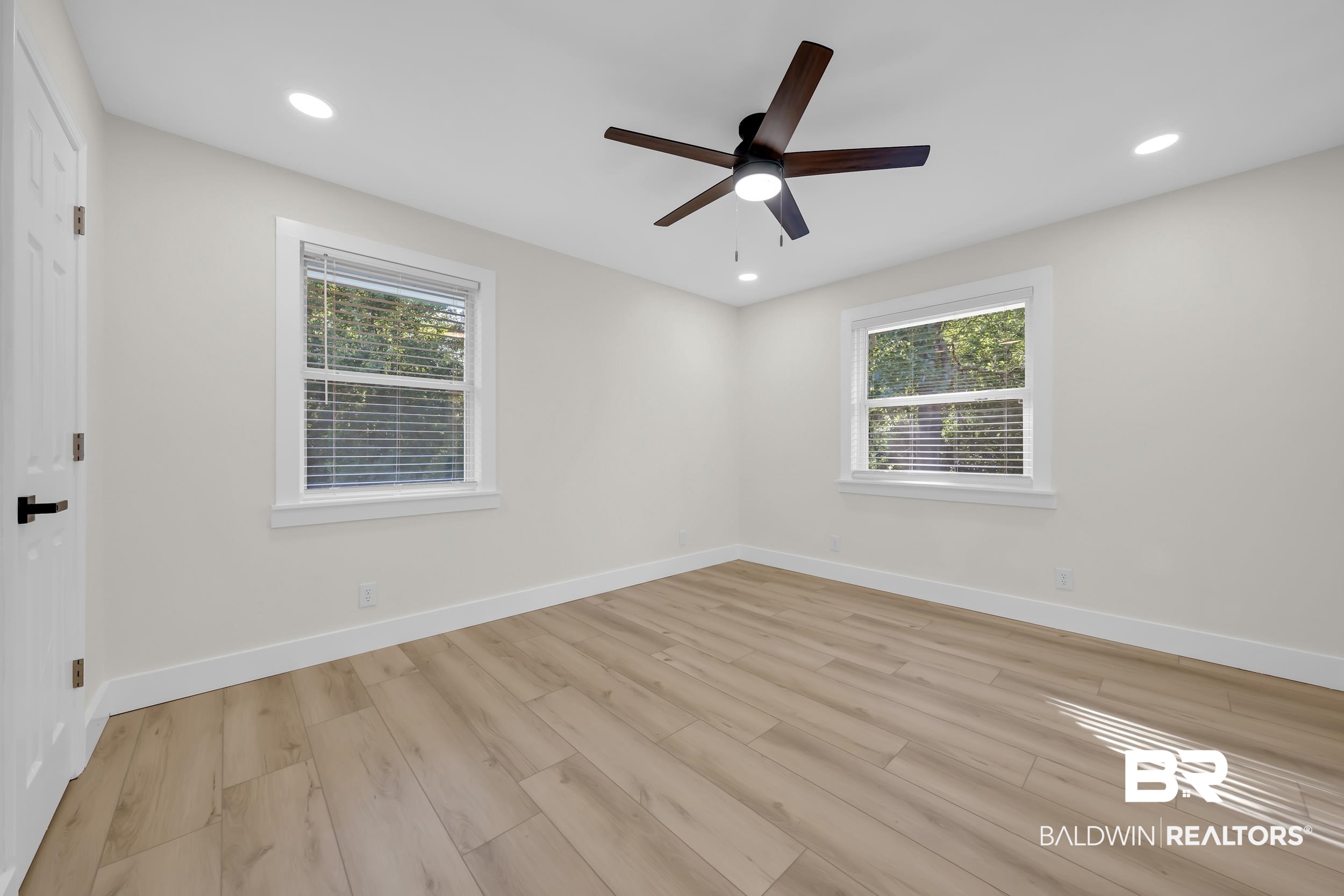 8170 Wilmer Georgetown Road Wilmer, AL 36587 - Photo 11 of 31 Spacious room featuring wood-finish flooring, recessed lighting, and a ceiling fan with integrated light