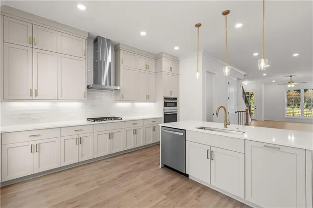 a kitchen with white cabinets