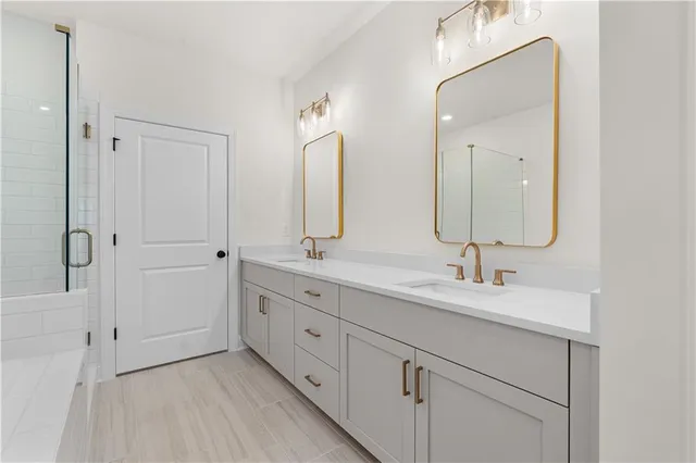 an empty room with a bathroom and a sink