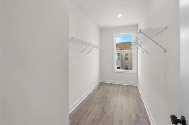 an empty room with a window and a garage