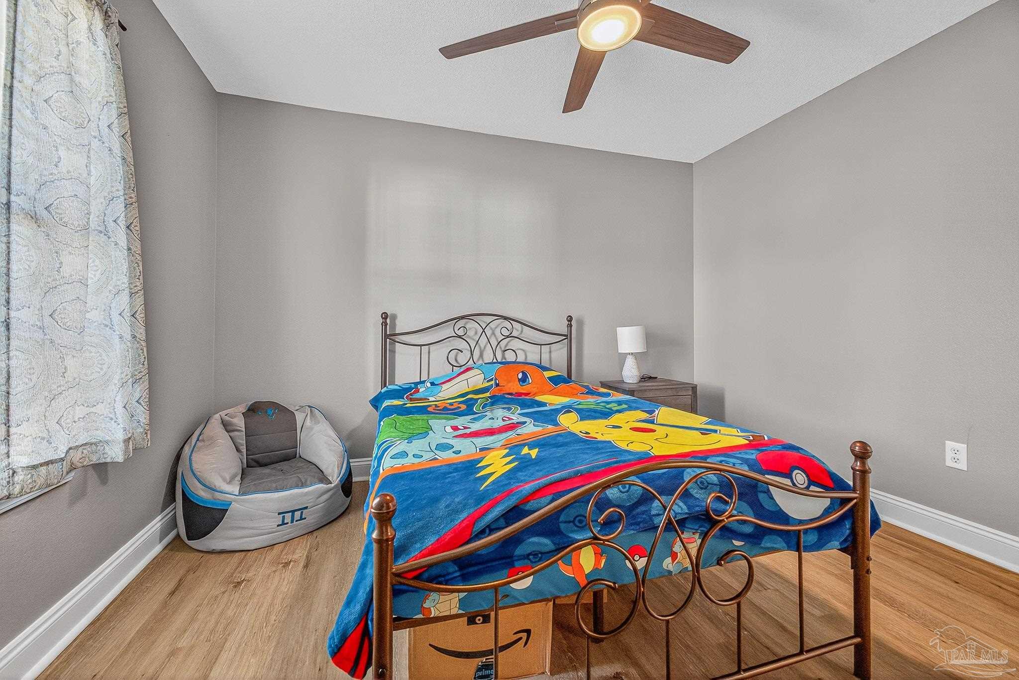 5361 Willard Norris Road Milton, FL 32570 - Photo 31 of 51 a bedroom with a bed and a small place