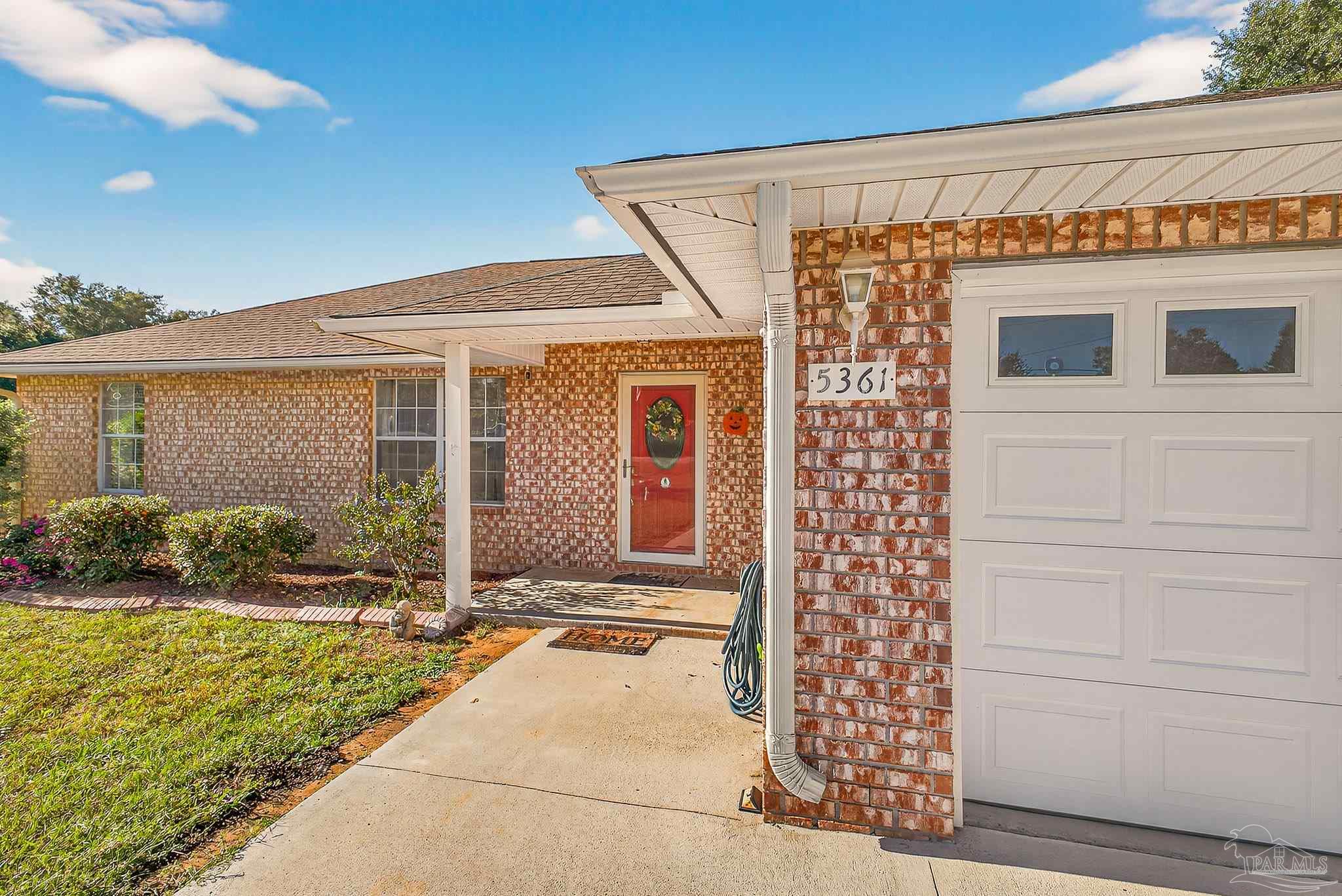 5361 Willard Norris Road Milton, FL 32570 - Photo 4 of 51 a front view of a house with a yard