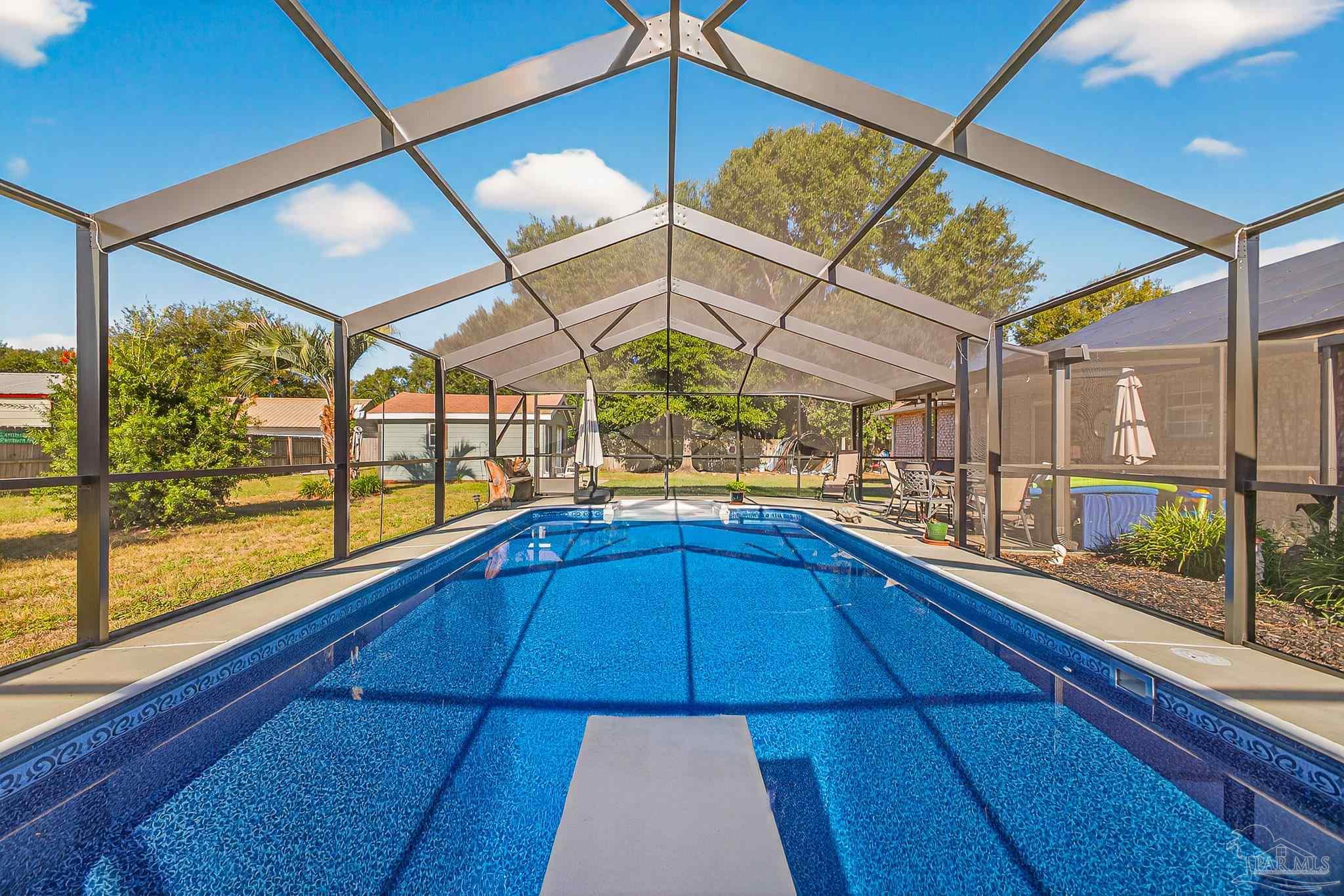 5361 Willard Norris Road Milton, FL 32570 - Photo 42 of 51 a kitchen with a sink and wooden cabinets