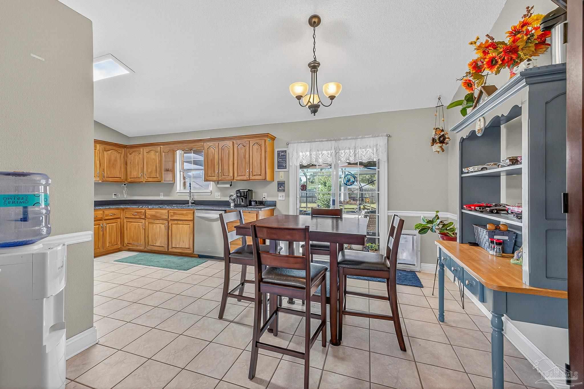 5361 Willard Norris Road Milton, FL 32570 - Photo 10 of 51 a view of a dining room with furniture and a window