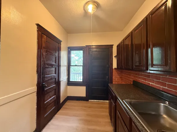 a kitchen that has a sink and a stove