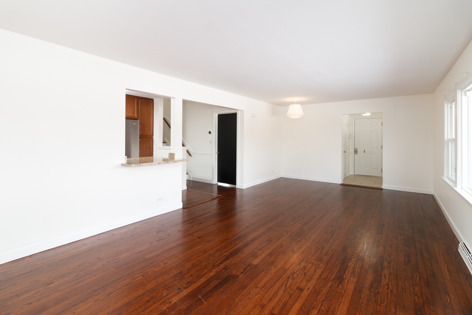 1005 West Pendleton Place Mount Prospect, IL 60056 - Photo 4 of 24 a view of an empty room with wooden floor