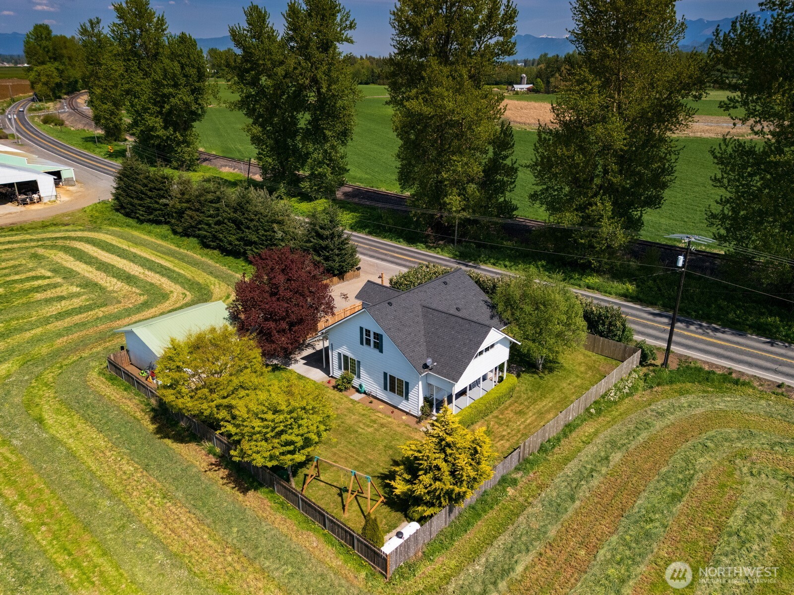 8429 Nooksack Road Everson, WA 98247 - Photo 1 of 38 a view of a swimming pool with a garden