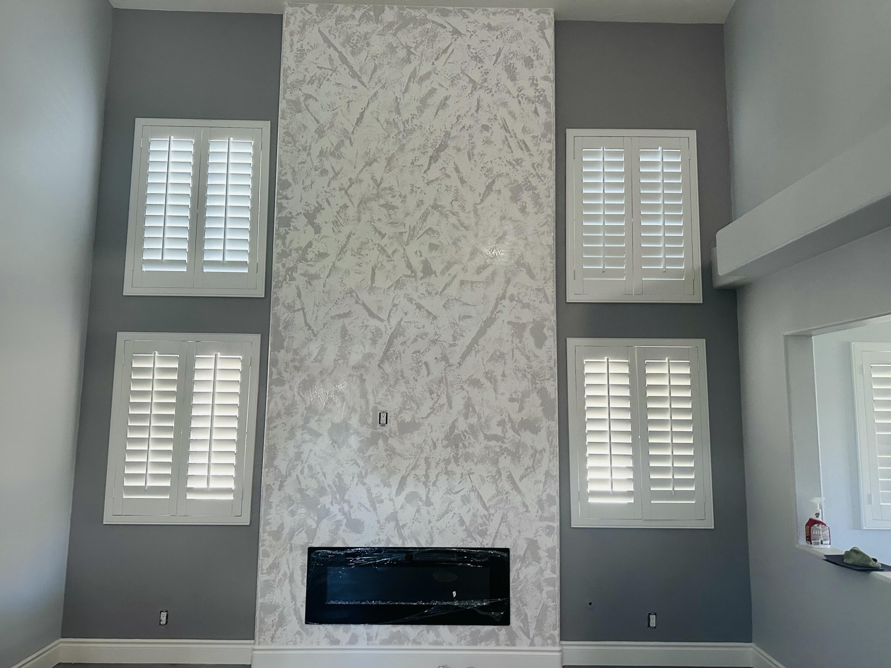 47675 Peony Place Indio, CA 92201 - Photo 7 of 8 a living room with a fireplace and a window