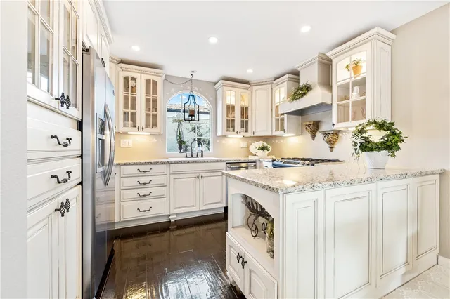 a stove top oven sitting inside of a kitchen