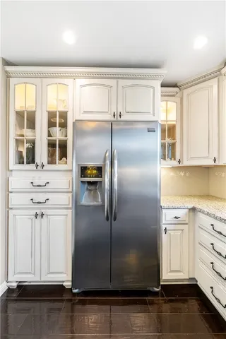 a living room with furniture large window and a fireplace