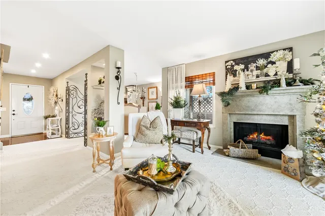a view of a hallway with wooden floor and windows