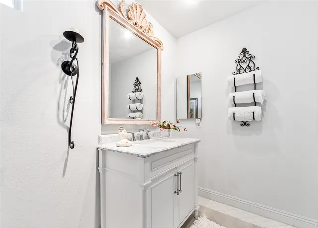 a spacious bedroom with a bed and a window