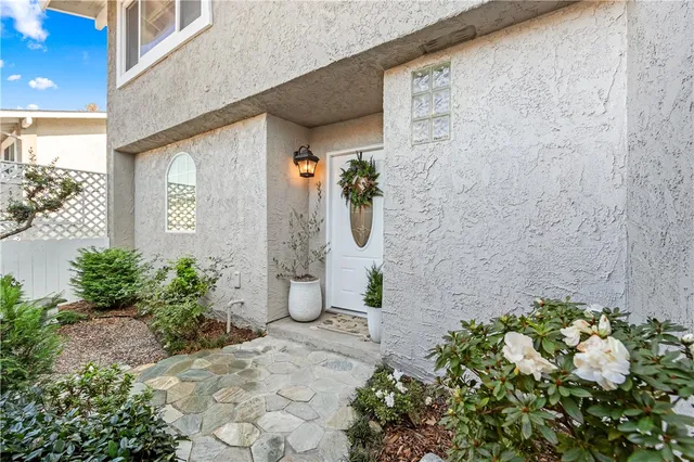 a view of an entryway with wooden floor