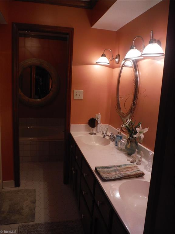 1801 Neelley Road Pleasant Garden, NC 27313 - Photo 14 of 20 Double sinks, separate shower & adjacent private room with commode & soaking tub