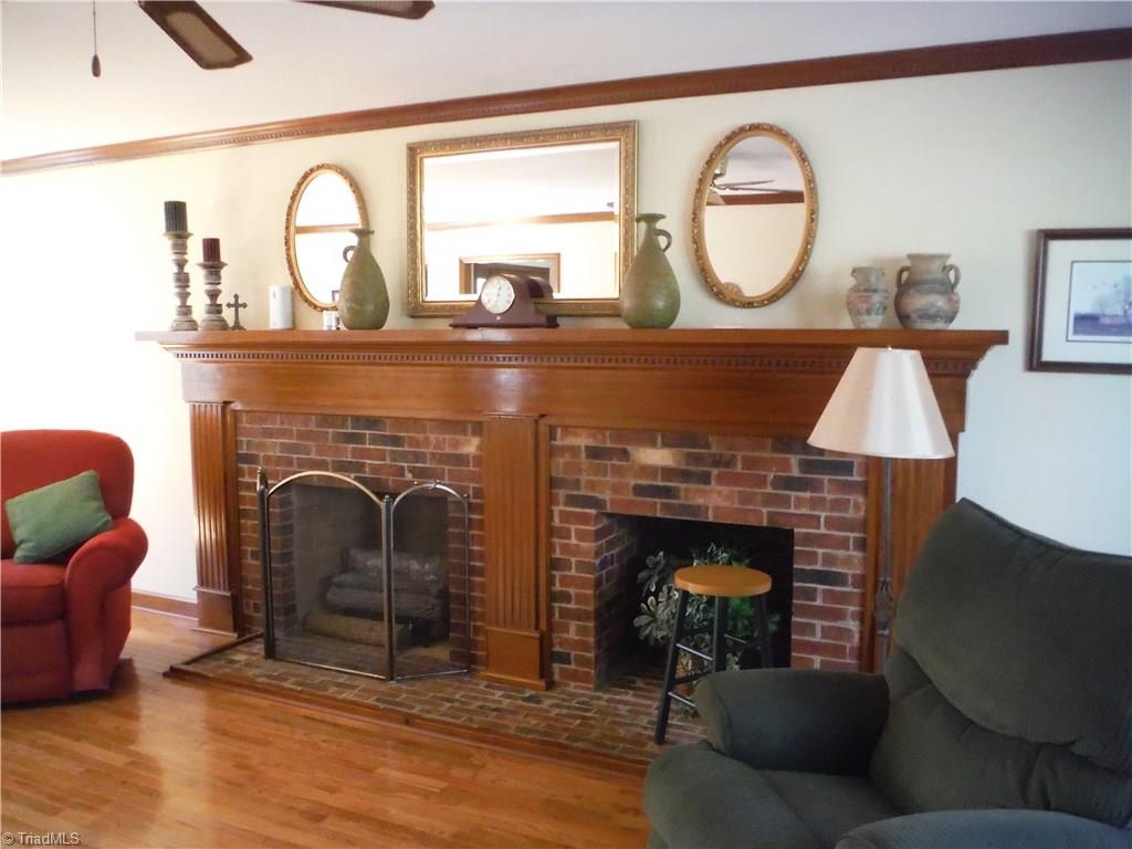 1801 Neelley Road Pleasant Garden, NC 27313 - Photo 5 of 20 ...and attractive brick FPL with handy wood storage area!