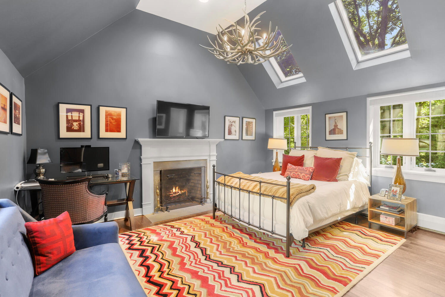 13 Searles Road Darien, CT 06820 - Photo 21 of 35 a bedroom with a bed a couch and wooden floor