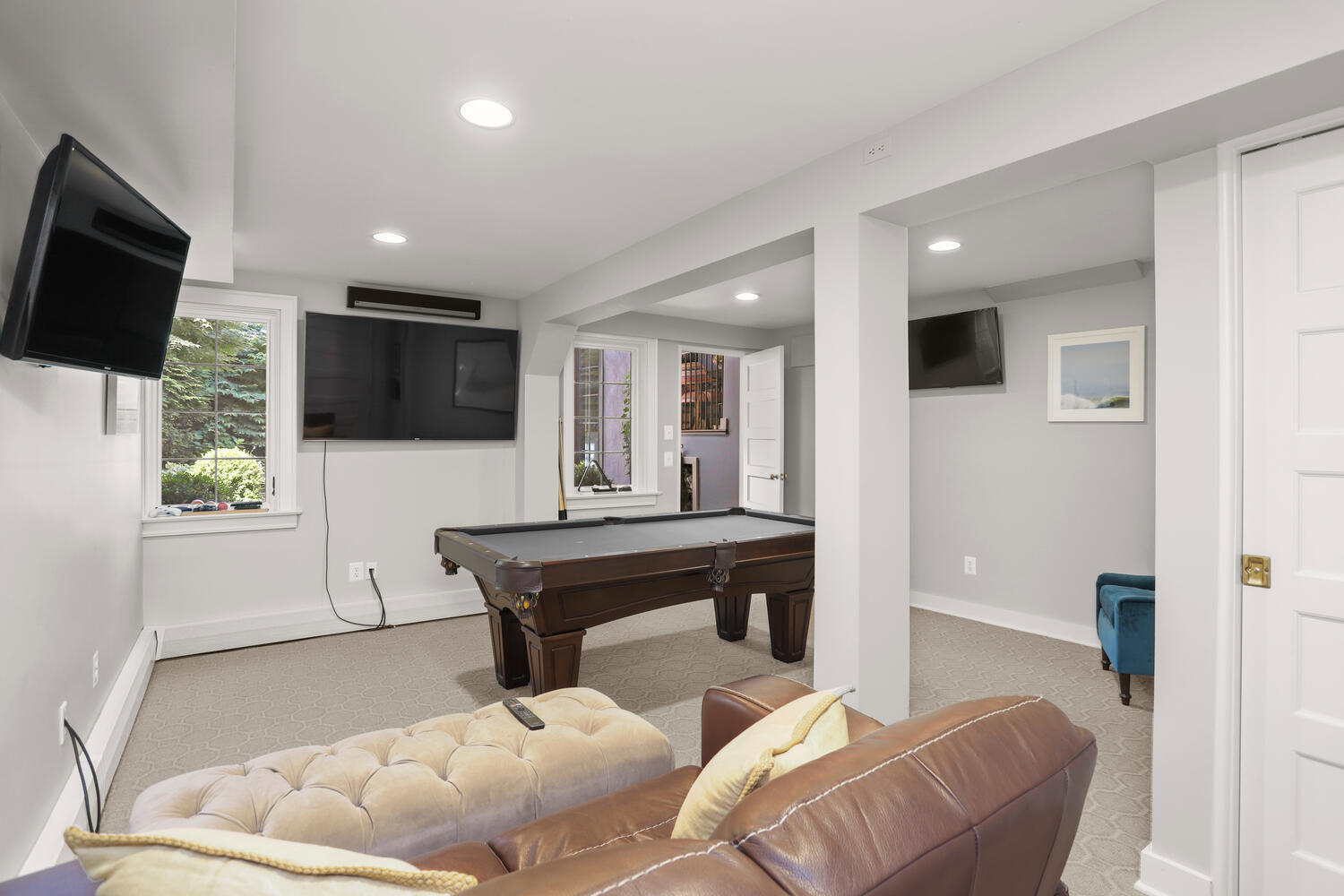 13 Searles Road Darien, CT 06820 - Photo 25 of 35 a living room with furniture and a flat screen tv