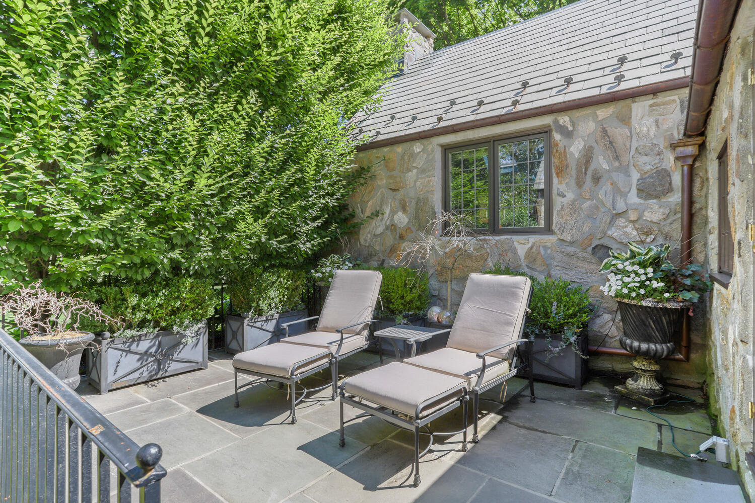 13 Searles Road Darien, CT 06820 - Photo 29 of 35 a view of a patio with couple of chairs and a potted plant