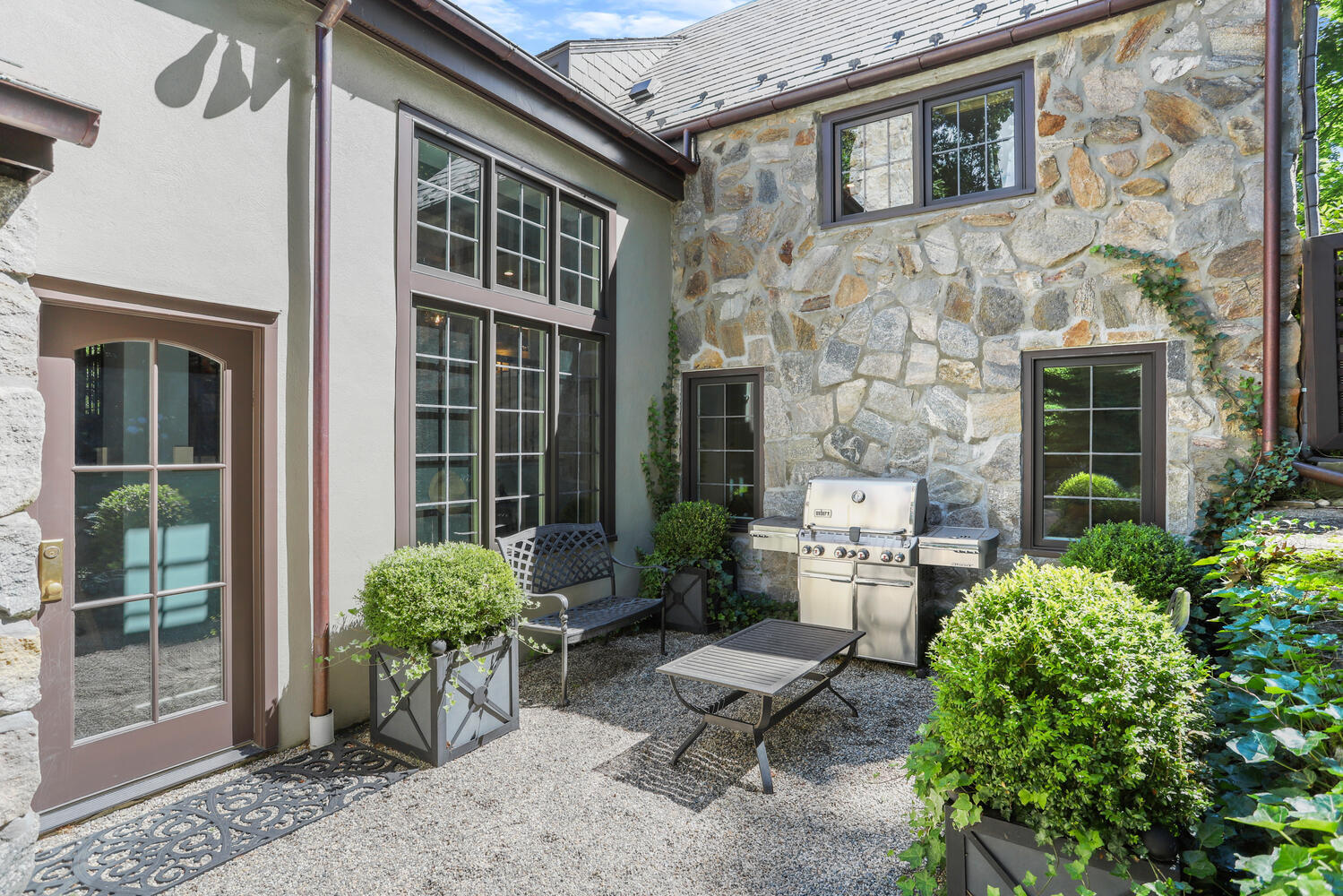 13 Searles Road Darien, CT 06820 - Photo 30 of 35 a backyard of a house with outdoor seating