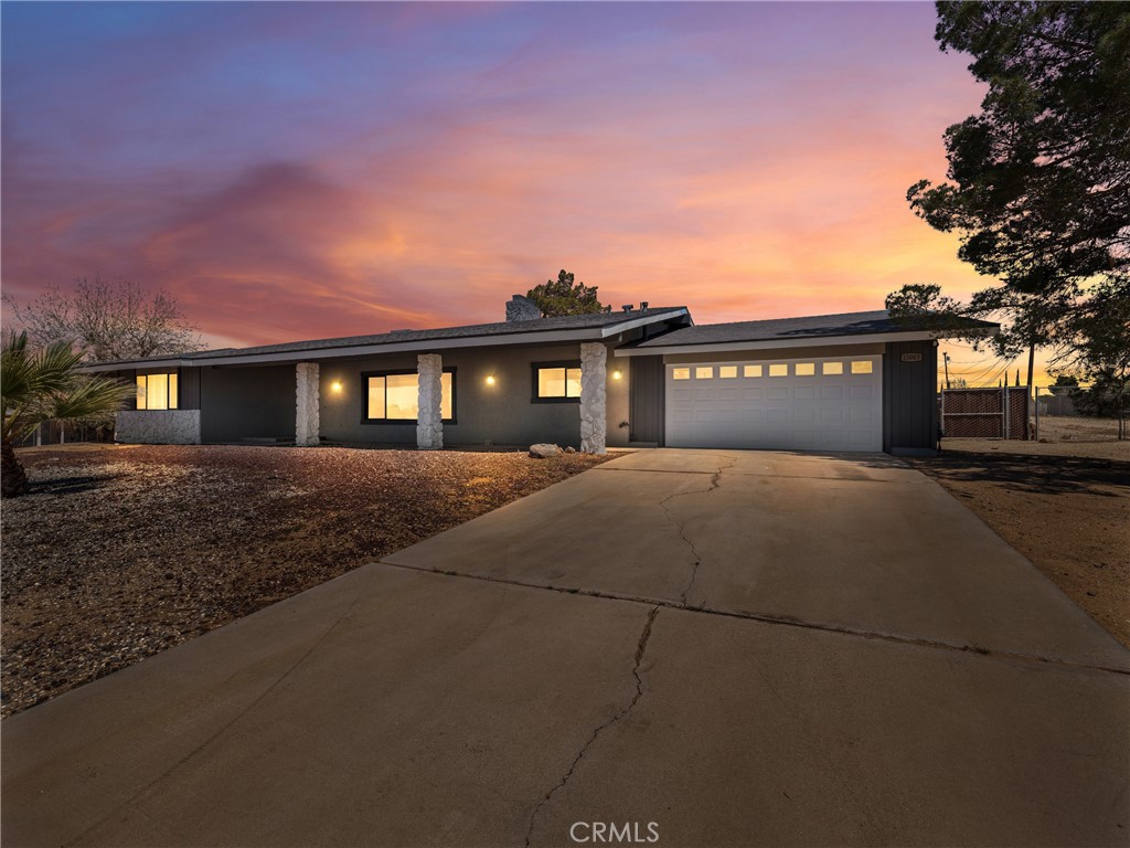 15003 Genesee Road Apple Valley, CA 92307 - Photo 1 of 1 a front view of house with yard