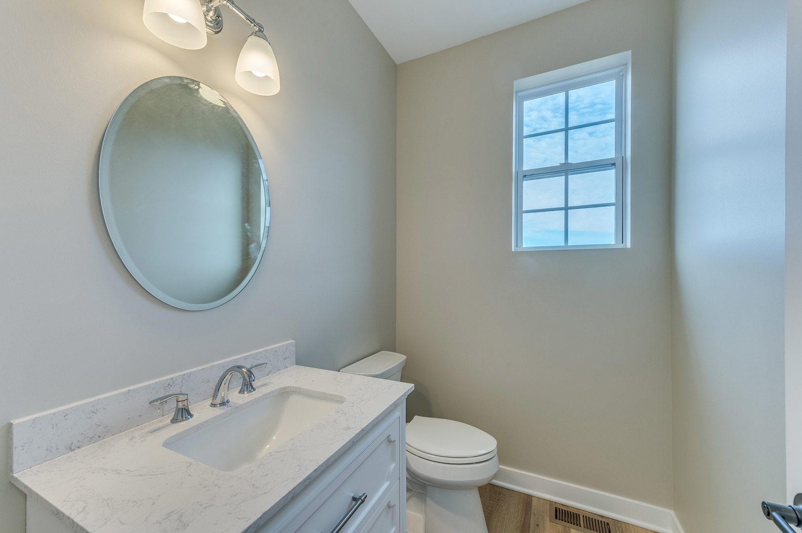 1104 Freedom Road Elburn, IL 60119 - Photo 16 of 24 a bathroom with a toilet a sink and mirror