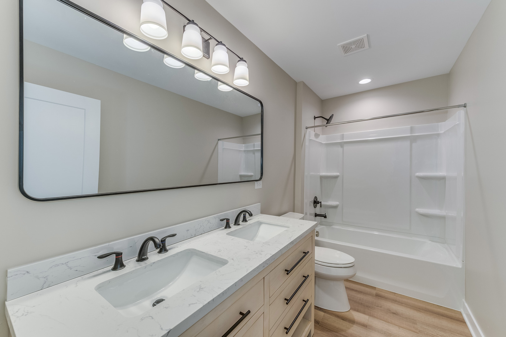 1104 Freedom Road Elburn, IL 60119 - Photo 20 of 24 a bathroom with a sink double vanity granite tub and a mirror