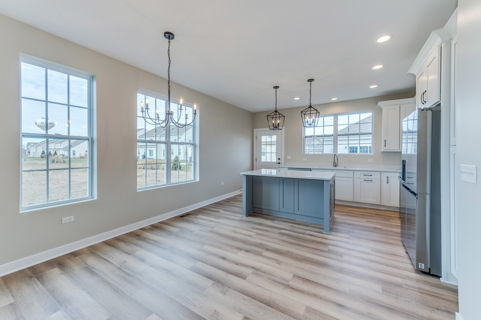 1104 Freedom Road Elburn, IL 60119 - Photo 6 of 24 a view of kitchen and hall with wooden floor