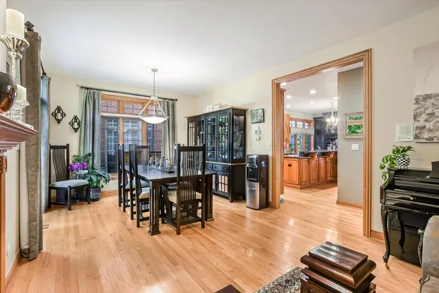 a kitchen with stainless steel appliances granite countertop a stove top oven a sink dishwasher and cabinets with wooden floor