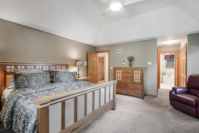 a bedroom with a bed and glass window