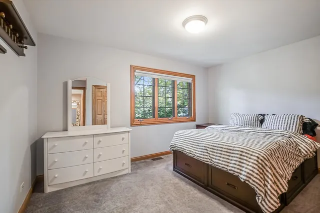 a bedroom with a bed and furniture