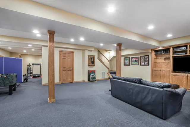 a view of a hallway with workspace and a mirror