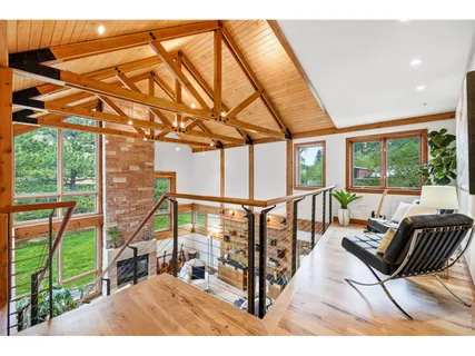 a living room with a couch a table next to a large window