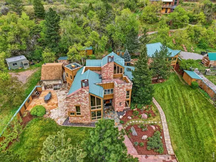 an aerial view of residential house with outdoor space and parking