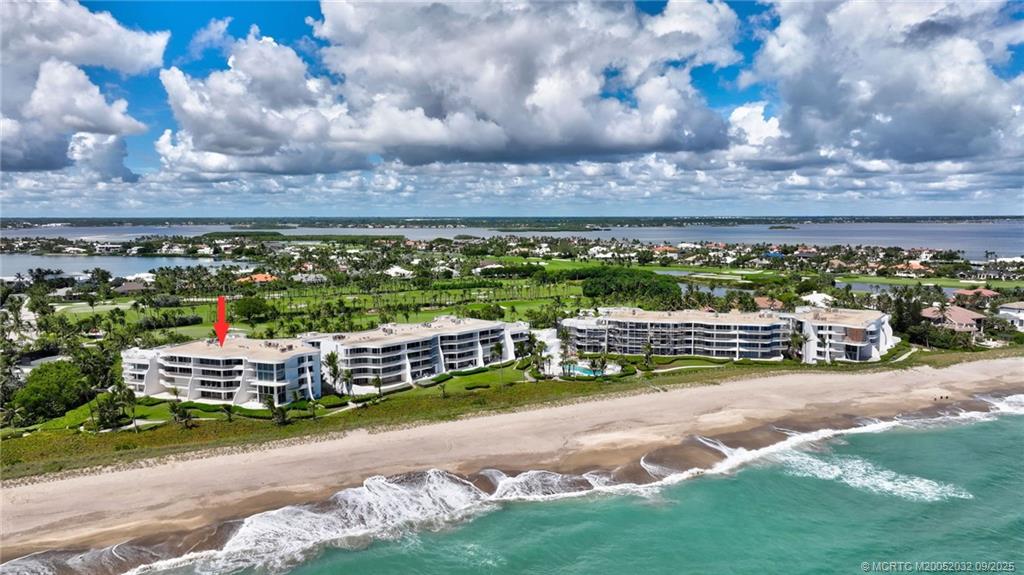2001 Southeast Sailfish Point Boulevard, Unit 303 Stuart, FL 34996 - Photo 2 of 63 a view of a city with lots of trees